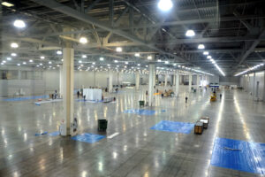 A large room with many tables and chairs.