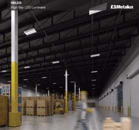 A warehouse with boxes and people walking around.
