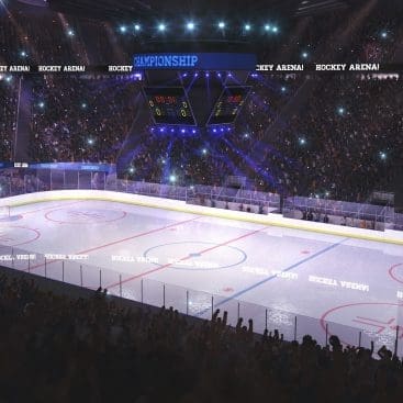 A hockey rink with fans in the stands.