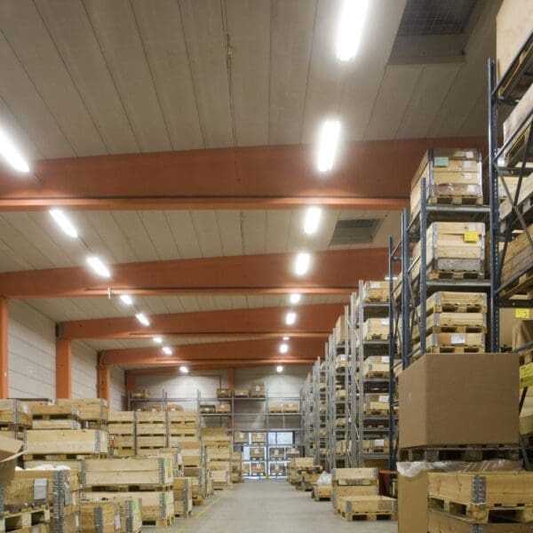 A warehouse filled with lots of boxes and pallets.