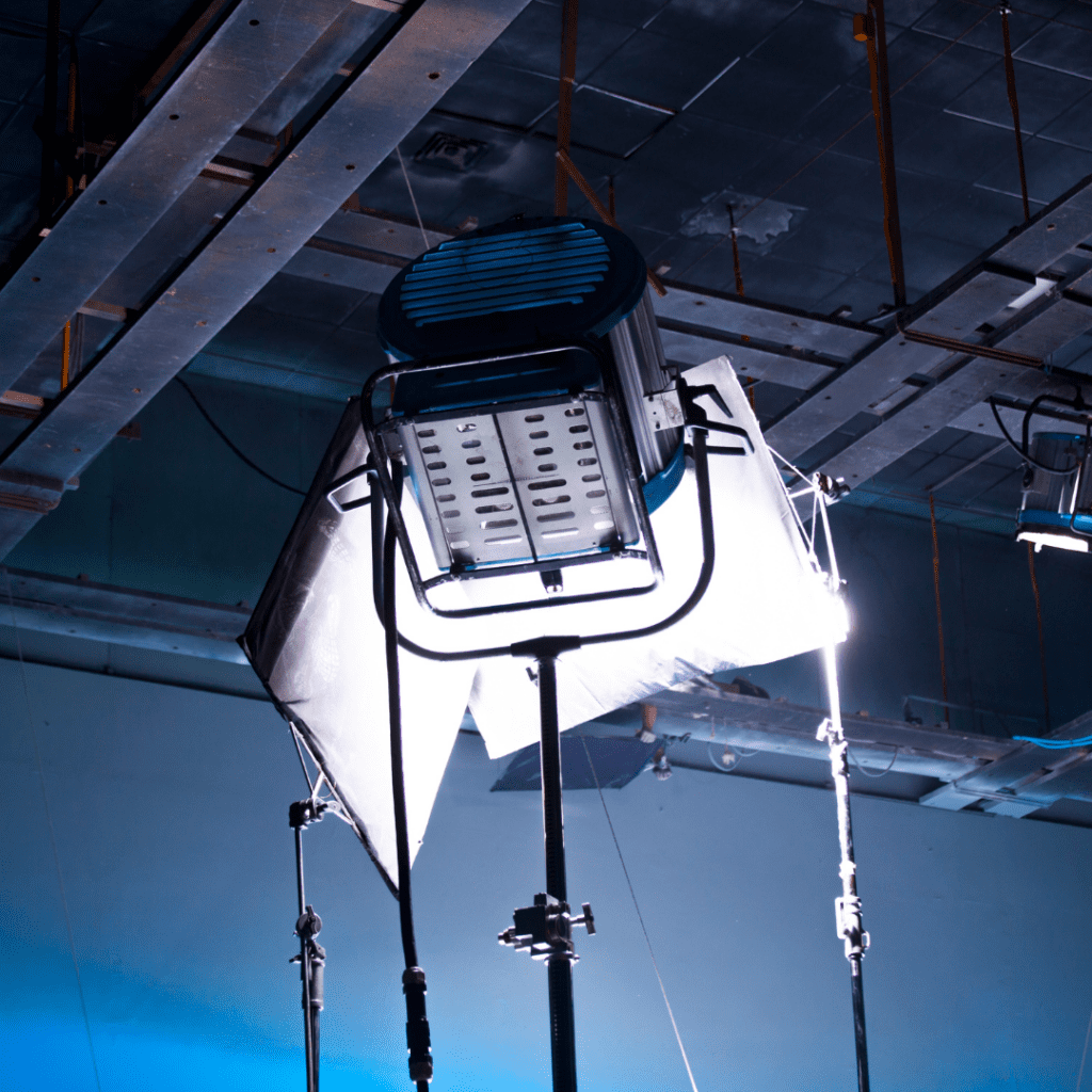 A light is hanging from the ceiling of an industrial building.